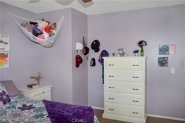 bedroom featuring baseboards and ceiling fan
