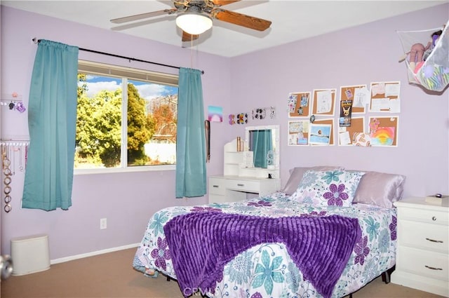 bedroom with baseboards, ceiling fan, and carpet