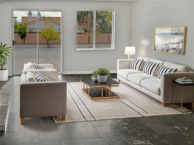 living area with plenty of natural light and baseboards