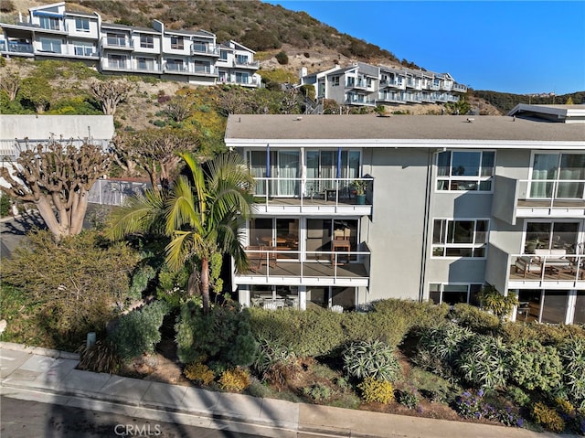 view of building exterior with a mountain view