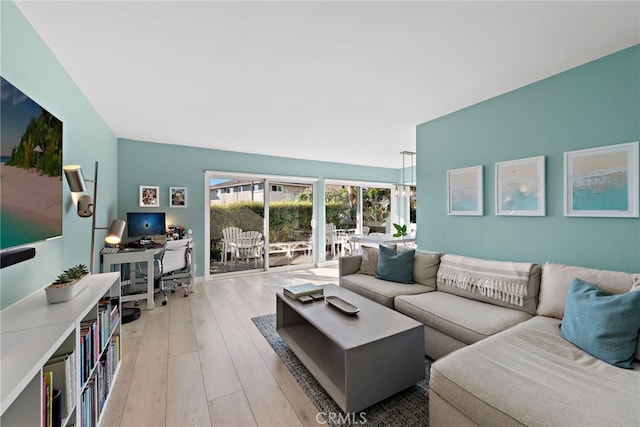 living room with light hardwood / wood-style flooring