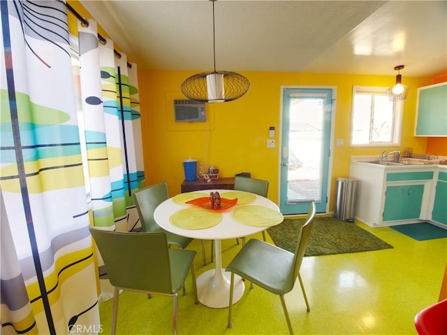 dining space with sink and radiator