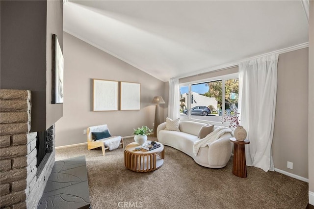 living area featuring lofted ceiling, carpet, baseboards, and a brick fireplace