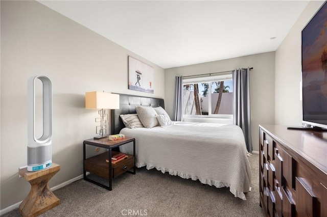 carpeted bedroom with baseboards