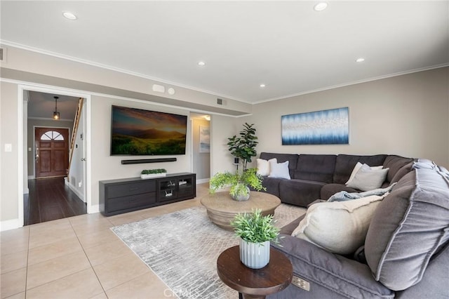 living room featuring tile patterned flooring, recessed lighting, visible vents, baseboards, and ornamental molding