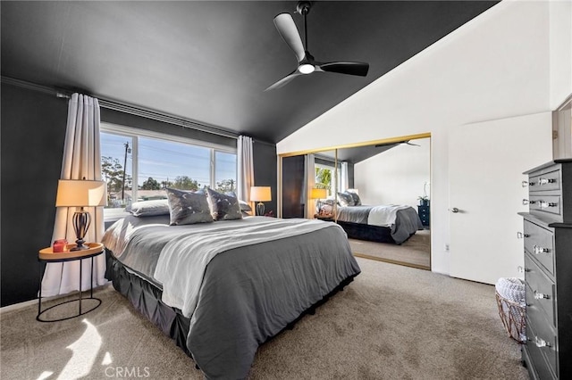 bedroom with carpet floors, a closet, vaulted ceiling, and ceiling fan