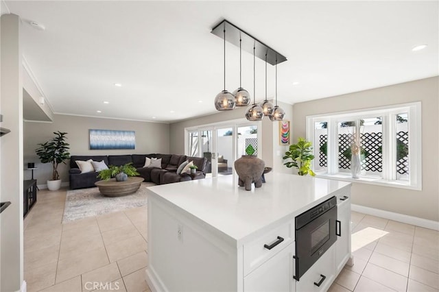 kitchen featuring black microwave, light tile patterned floors, and recessed lighting