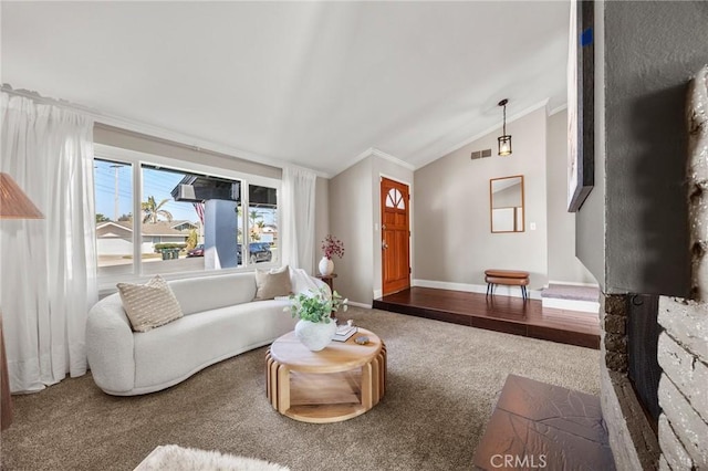 living area with carpet, lofted ceiling, visible vents, ornamental molding, and baseboards