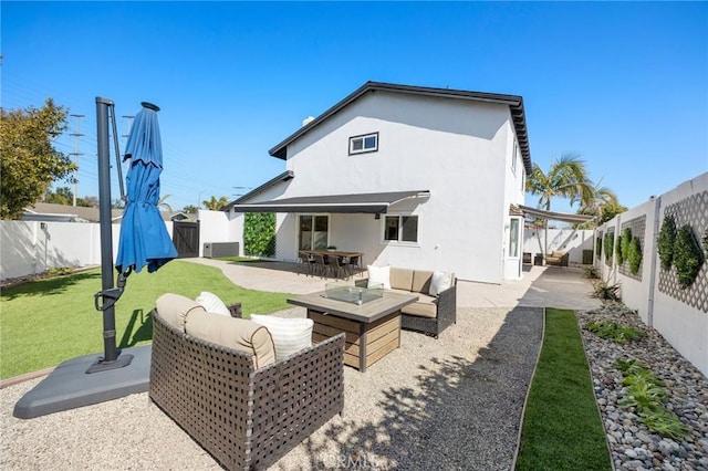 back of house with outdoor lounge area, a patio, and a fenced backyard