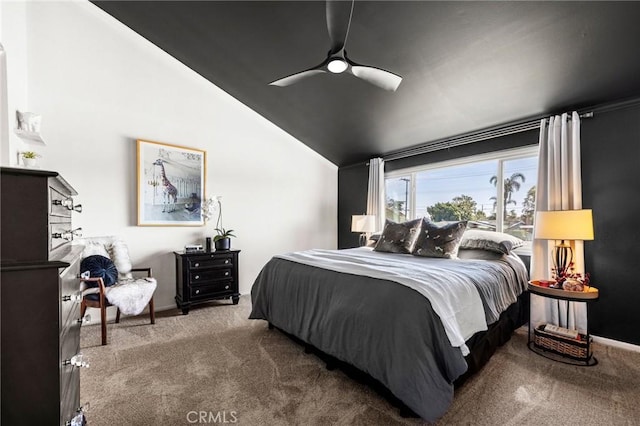 carpeted bedroom with vaulted ceiling and ceiling fan