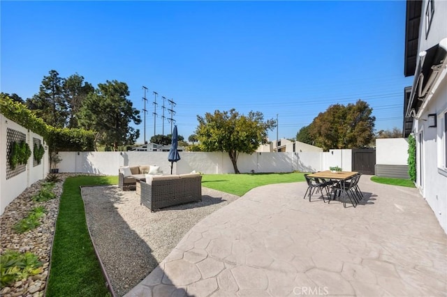 view of patio / terrace with outdoor dining area, a fenced backyard, and outdoor lounge area