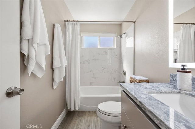 bathroom featuring toilet, shower / tub combo, wood finished floors, vanity, and baseboards