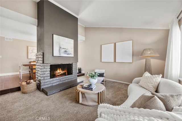 carpeted living area with a fireplace, visible vents, baseboards, vaulted ceiling, and crown molding