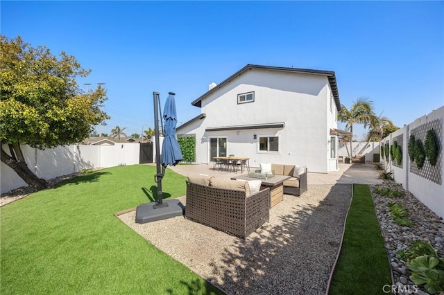 back of house featuring a yard, a fenced backyard, an outdoor living space, and a patio