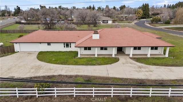 exterior space with a garage and a front yard