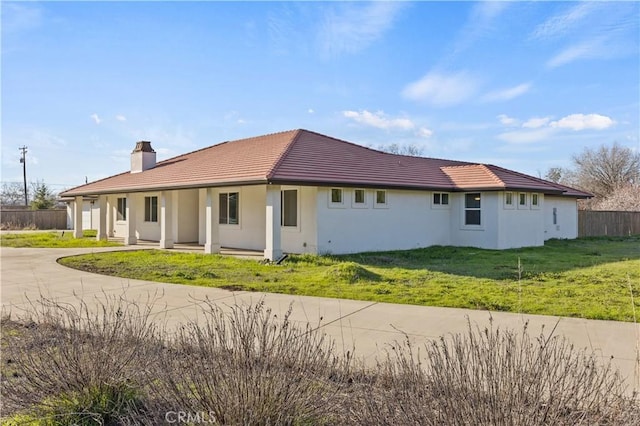 back of house featuring a yard