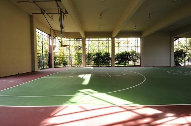 view of basketball court with community basketball court and fence