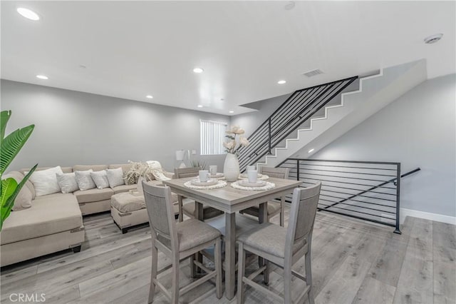 dining room with light wood-type flooring