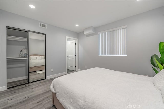 bedroom with light hardwood / wood-style floors