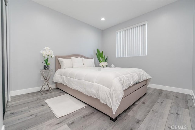 bedroom with light hardwood / wood-style flooring