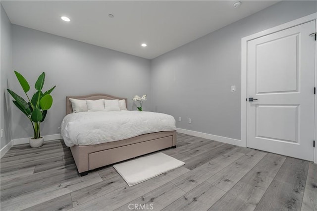 bedroom with light hardwood / wood-style floors