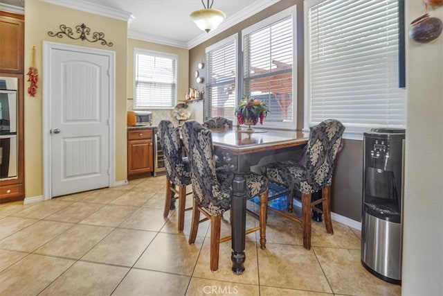 5003 Thornberry Way, Fontana, CA 92336 - dining space featuring baseboards, beverage cooler, crown molding, and light tile patterned flooring