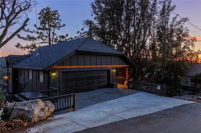 garage featuring concrete driveway