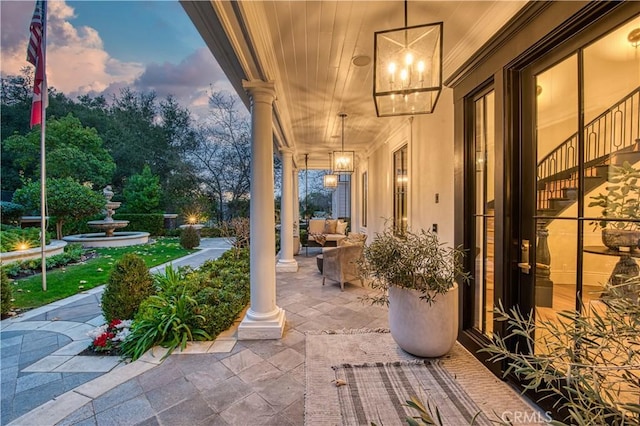 view of patio terrace at dusk