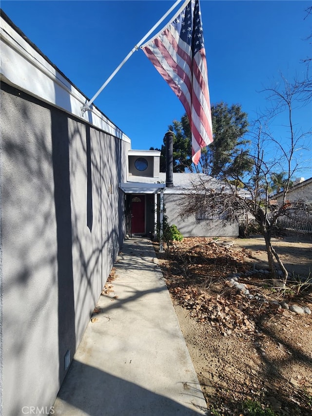 entrance to property featuring fence