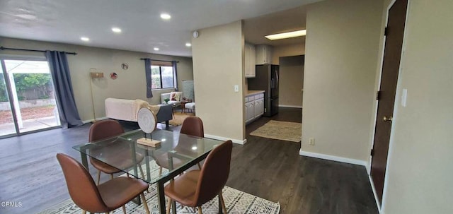dining area featuring baseboards, dark wood-style floors, a healthy amount of sunlight, and recessed lighting