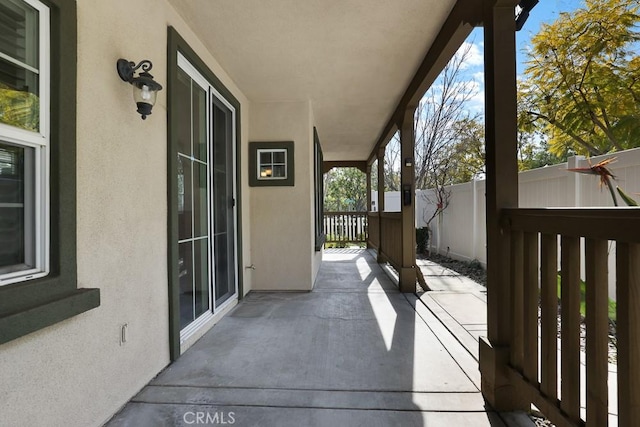 view of patio / terrace featuring fence