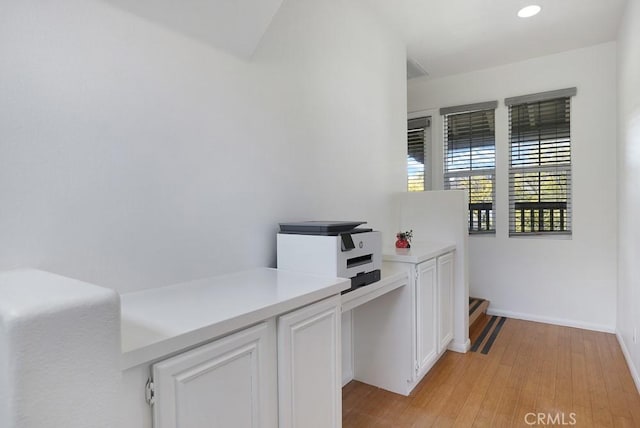 office featuring light wood-type flooring, baseboards, and recessed lighting