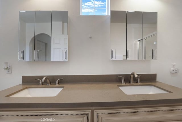 bathroom with double vanity and a sink