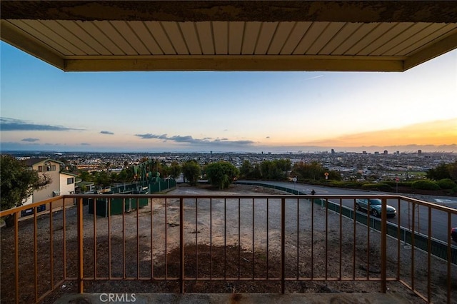 view of balcony at dusk