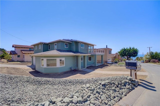 view of front of house with a balcony