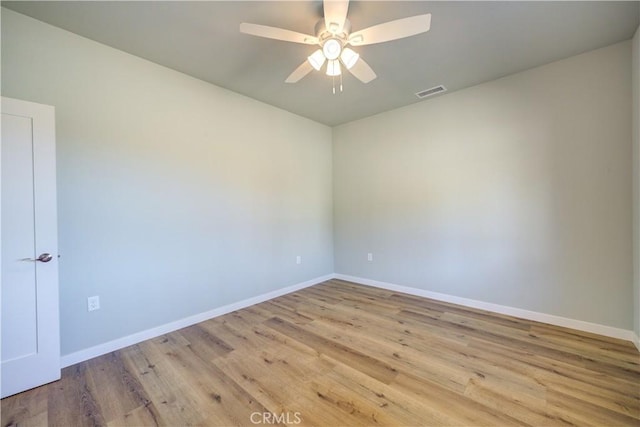 unfurnished room featuring ceiling fan and light wood-type flooring