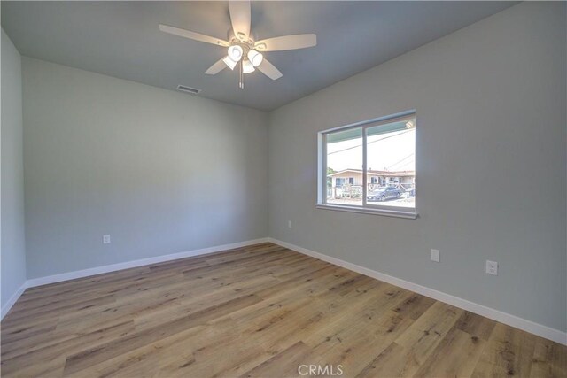 unfurnished room featuring ceiling fan and light hardwood / wood-style floors