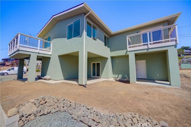 back of house with a patio area