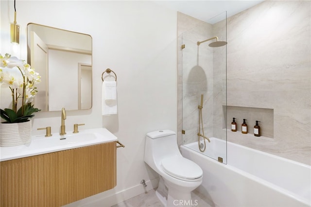 full bathroom with vanity, tiled shower / bath combo, and toilet