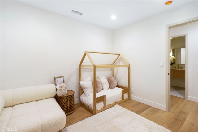 bedroom featuring light hardwood / wood-style floors