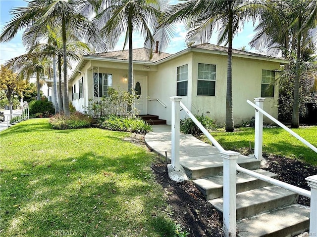 view of front of home featuring a front lawn