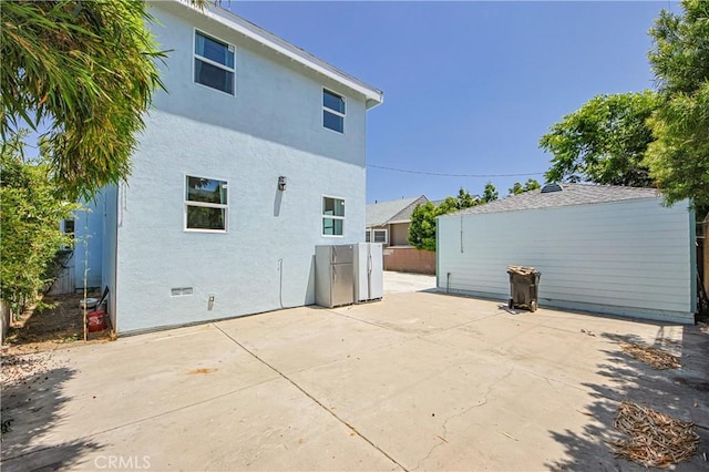 back of house with a patio area