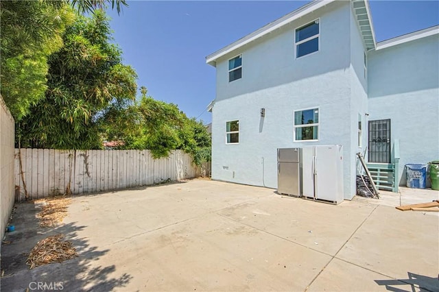 rear view of house featuring a patio