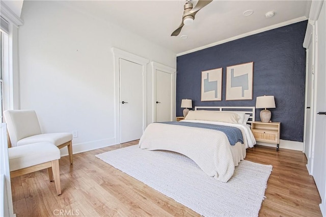 bedroom featuring hardwood / wood-style flooring and ceiling fan