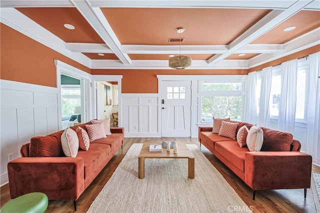 living room with beamed ceiling, a healthy amount of sunlight, and coffered ceiling