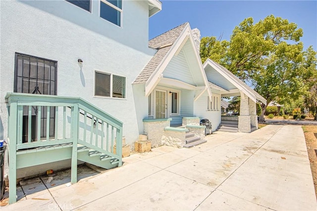 back of property with a patio