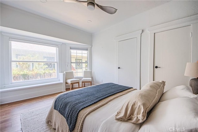 bedroom featuring hardwood / wood-style flooring and ceiling fan