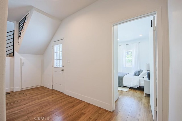 bonus room featuring hardwood / wood-style flooring and lofted ceiling