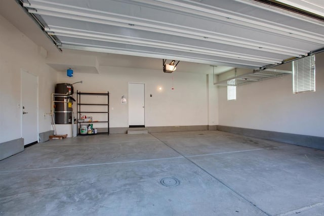 garage featuring baseboards and a garage door opener