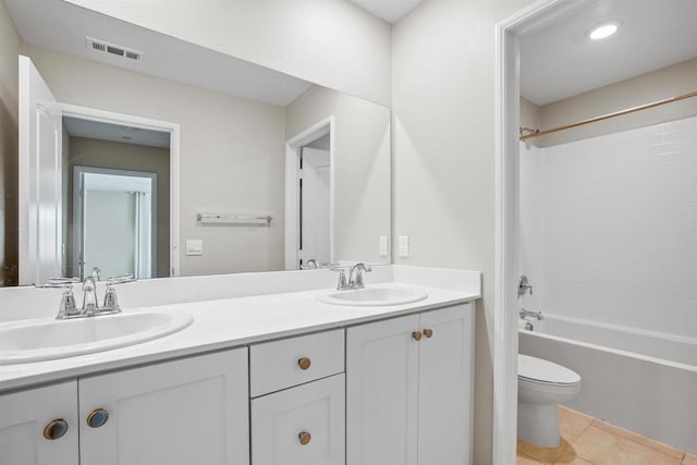 full bathroom featuring visible vents, a sink, toilet, and double vanity